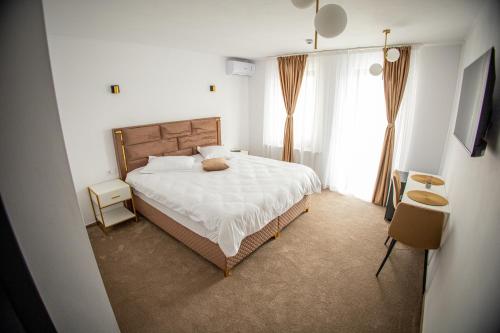 En eller flere senge i et værelse på Moment Residence