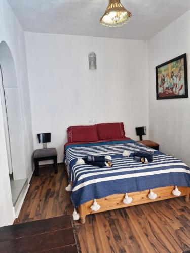 Postel nebo postele na pokoji v ubytování le grand atlas