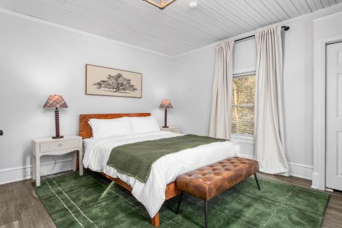 a bedroom with a large bed and a window at Cozy 3BD with Air Hockey, BBQ - Near Duke University in Durham