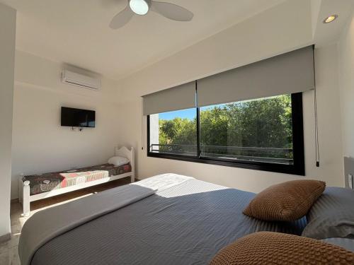 En eller flere senge i et værelse på El Rincón del Bosque