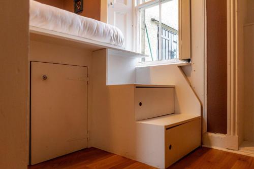 a room with a bed and a window at The Winkle - Elie in Elie