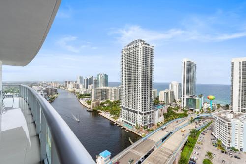 a view of a city with a river and buildings at Spacious Luxury Apartment at Beachwalk Resort with Ocean Views and Private Foyer in Hallandale Beach