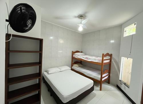 Ένα ή περισσότερα κρεβάτια σε δωμάτιο στο Marujo da Gávea