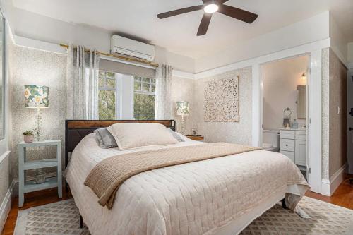 a bedroom with a bed and a ceiling fan at Hemlock Room in Berkeley