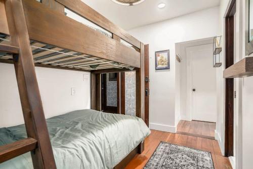 a bedroom with two bunk beds and a hallway at Maple Family Suite in Berkeley