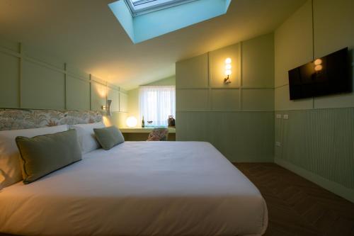 Postel nebo postele na pokoji v ubytování Villa Bellarosa