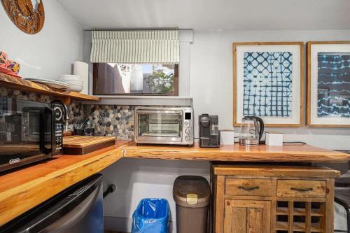 a kitchen with a counter top with a microwave at Redwood Room in Berkeley