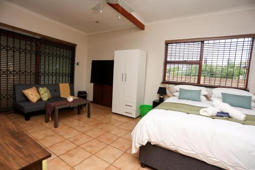 En eller flere senge i et værelse på African Oasis Zambia