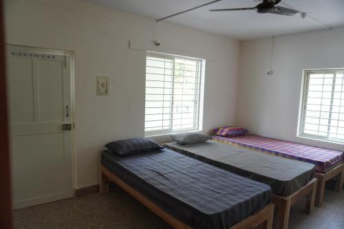 En eller flere senge i et værelse på Cornerbunker