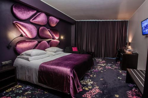 Ένα ή περισσότερα κρεβάτια σε δωμάτιο στο Aqva Hotel & Spa