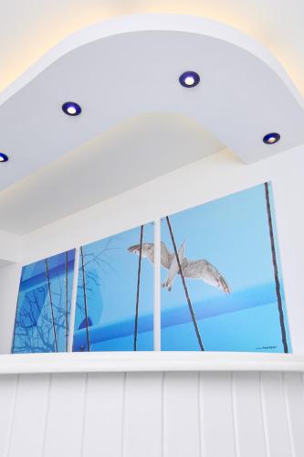 a bird flying in the window of a boat at Kazaviti Hotel in Prinos