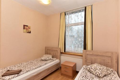 Ένα ή περισσότερα κρεβάτια σε δωμάτιο στο Leokordis, UAB