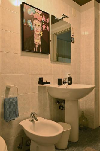 a bathroom with a sink and a toilet at Cerchio di Luce in Locorotondo