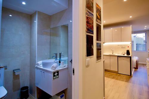 a bathroom with a sink and a counter top at Feel Porto in Bolhão "Metro at your doorstep" in Porto