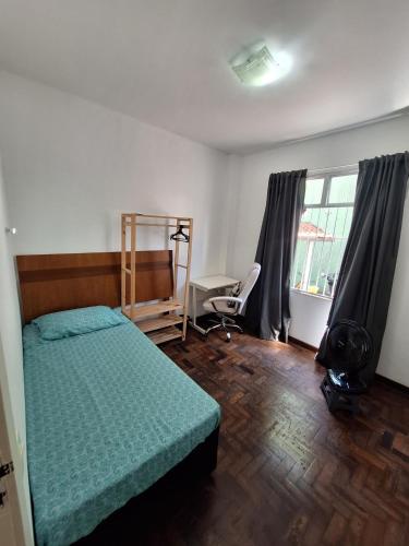 En eller flere senge i et værelse på Quarto tranquilo e familiar no leblon - Quiet family room in leblon