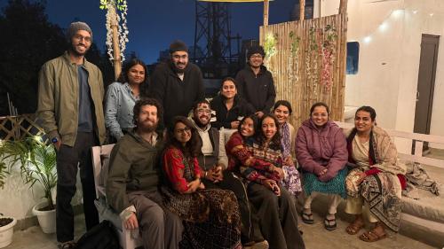 een groep mensen die poseren voor een foto bij SAIR Hostel, Varanasi - 100m from Assi Ghat in Varanasi