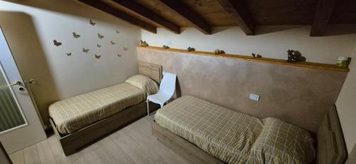 En eller flere senge i et værelse på La Mansarda sul lago