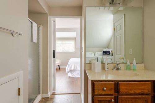 a bathroom with a sink and a mirror at Boat House in Downingtown