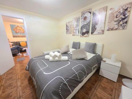 a bedroom with a large bed in a room at Santana Madeira Hiking Getaway near Pico Ruivo and Levadas Base in Santana