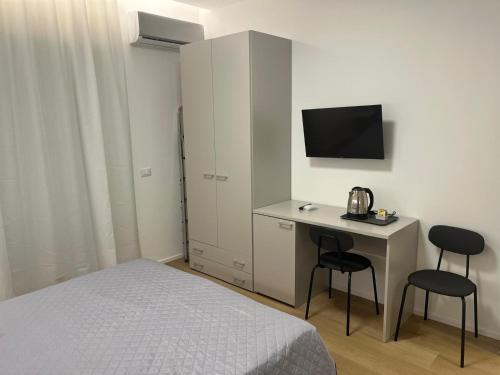 En eller flere senge i et værelse på Lungomare Vazzana