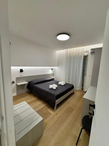 En eller flere senge i et værelse på Lungomare Vazzana