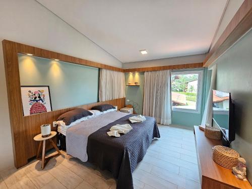 Postel nebo postele na pokoji v ubytování Chalé de Luxo no Meridional Club Praia dos Carneiros