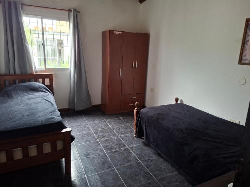 En eller flere senge i et værelse på Casa Bianca