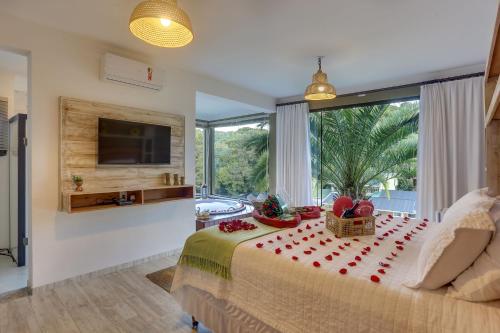 Μια τηλεόραση ή/και κέντρο ψυχαγωγίας στο Pousada Trem Chic