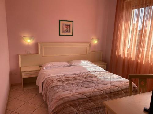 En eller flere senge i et værelse på Il Casale