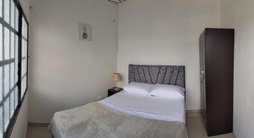 En eller flere senge i et værelse på Nuevo Olimpo 202 Family Central and quiet