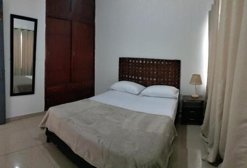 En eller flere senge i et værelse på Nuevo Olimpo 202 Family Central and quiet