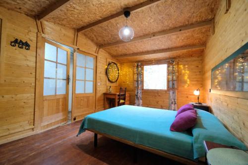 a bedroom with a bed in a wooden room at Villa Tamadaba Rural Home - Pet Friendly, Near Ocean, Ideal for Long Stays in Agaete