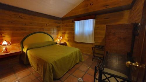 En eller flere senge i et værelse på Parque Girasoles Balneario & Cabañas