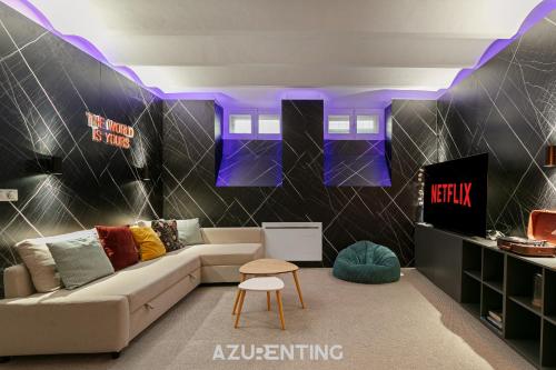 a living room with a couch and a table at Azurenting - Maison Césario - 3 chambres in Cannes