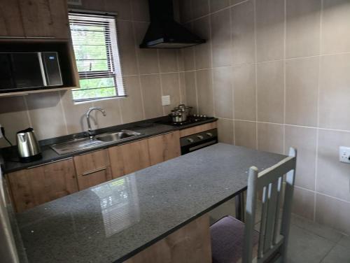 Kuchyň nebo kuchyňský kout v ubytování The Nelsons on 99 Smith