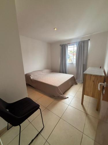 En eller flere senge i et værelse på Departamento Costa II