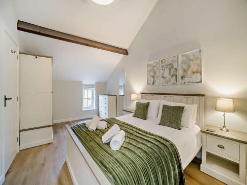 En eller flere senge i et værelse på 1 Bed in Bleadon 96393