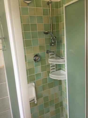 a bathroom with a sink and a shower at Chicco Frau appartamenti trattati con OZONO in Fluminimaggiore