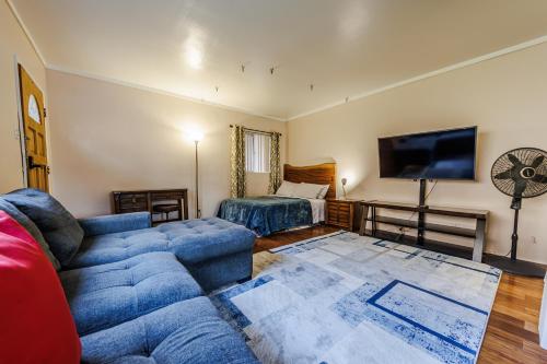 a living room with a couch and a bed at Spacious Single Apt D In Santa Monica in Los Angeles