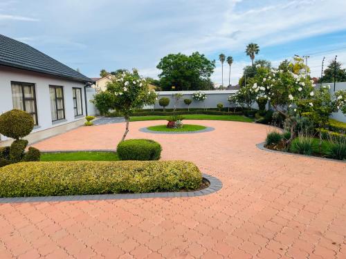 een stenen loopbrug voor een huis bij Loreho boutique in Mahikeng