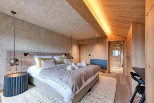 En eller flere senge i et værelse på Pontirolo Nuovo Chalet Zermatt