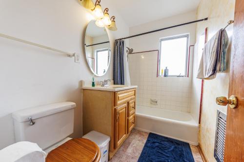 a bathroom with a tub and a sink and a mirror at Spacious Two Bedroom in Santa Monica #E in Los Angeles