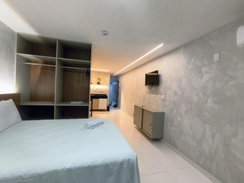 En eller flere senge i et værelse på Victory Tambaú