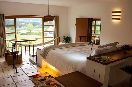 Postel nebo postele na pokoji v ubytování El Solaz By Honnor Living