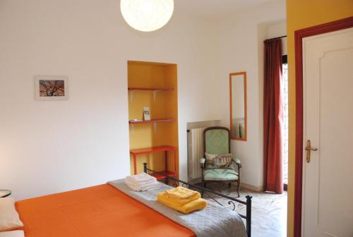 a bedroom with a bed with two towels on it at La Ripa Bed and Breakfast in Blera