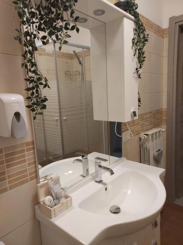 a bathroom with a white sink and a mirror at Girasole in Alessandria