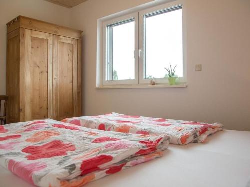 a bedroom with two beds and a window at Apartment im Illertal by Interhome in Altenstadt