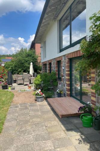 a wooden deck in front of a house at Apartment am Wurlsee by Interhome in Lychen