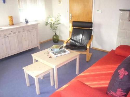 a living room with a couch and a coffee table at Holiday Home Buschle by Interhome in Tettnang