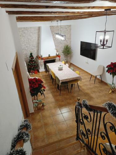 a living room with a table and a christmas tree at Señorío de Ves in Casas de Ves